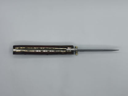 Couteau pliant Le Baou vue de dessous lame damas mitres ouvragées
