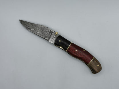 Couteau pliant acier damas Le Roucas manche tricolore noyer wengé padouk - Coutellerie Hosteel
